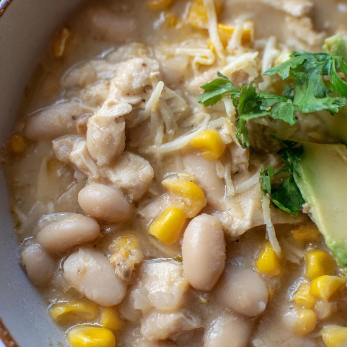 Topped with sliced avocado and cilantro, this cozy Tex-Mex dish looks incredibly creamy.