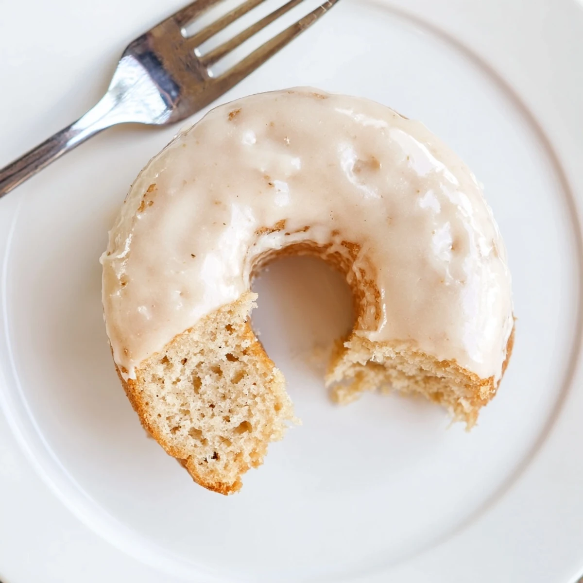 Golden baked donuts inspired by banana bread, topped with a simple glaze and perfect for snacking.