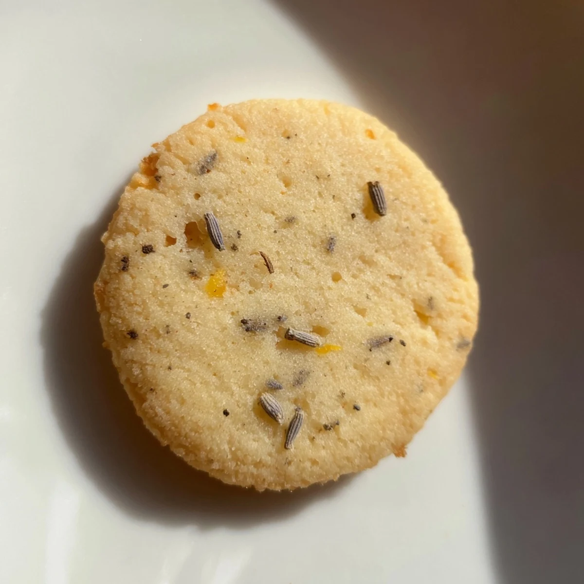 Plate of soft lemon lavender cookies dusted with powdered sugar for afternoon tea