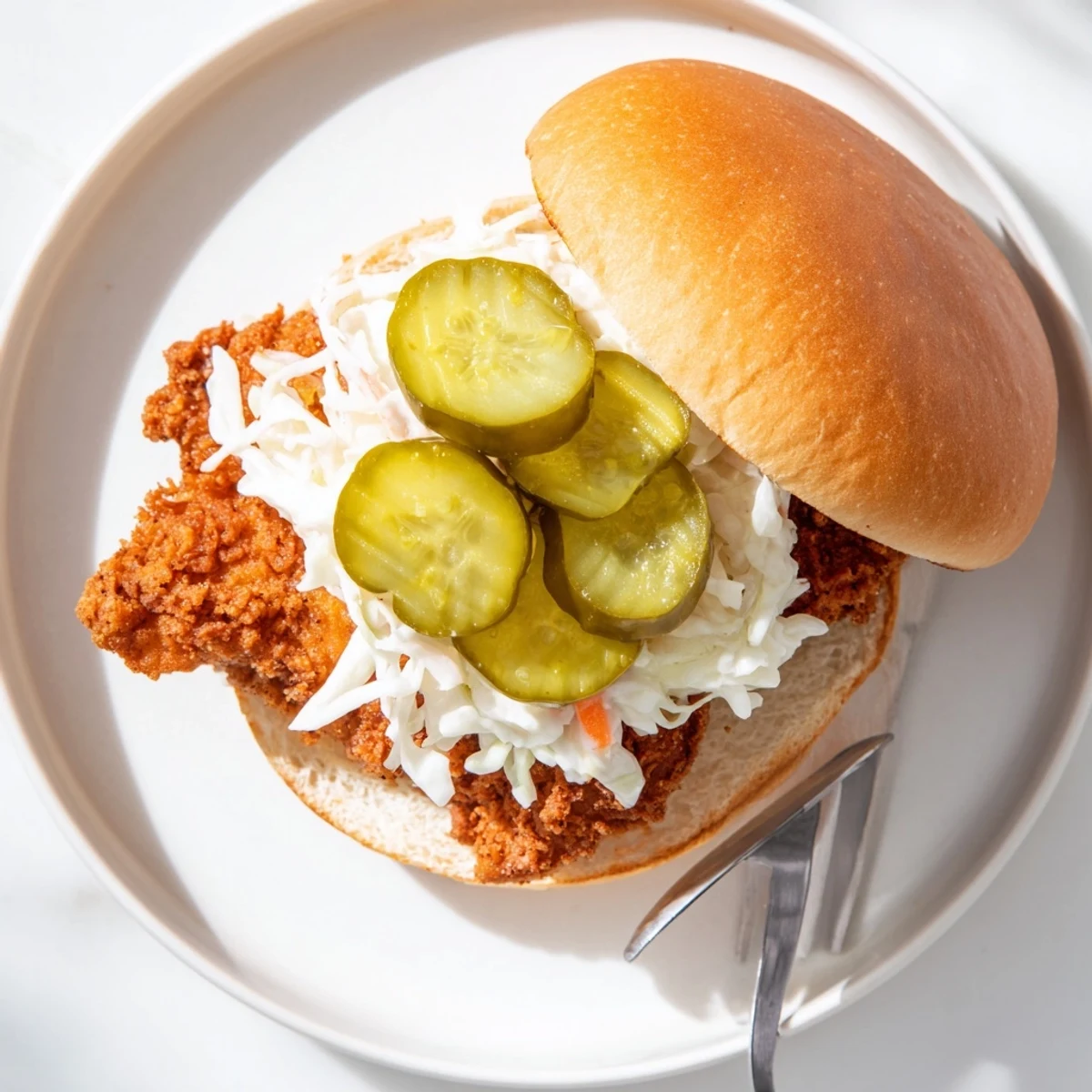 Juicy Southern spiced chicken fillet in toasted burger bun with crunchy slaw and tangy pickles