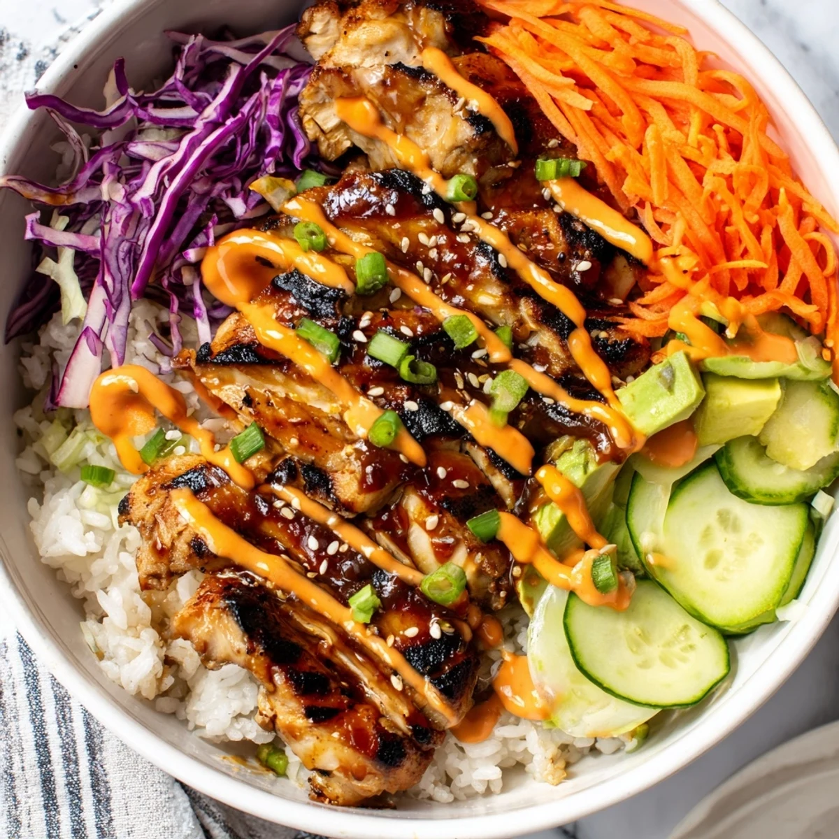 Colorful Korean BBQ Chicken Bowl featuring glazed grilled chicken over fluffy rice with fresh vegetables and creamy spicy gochujang mayo drizzle