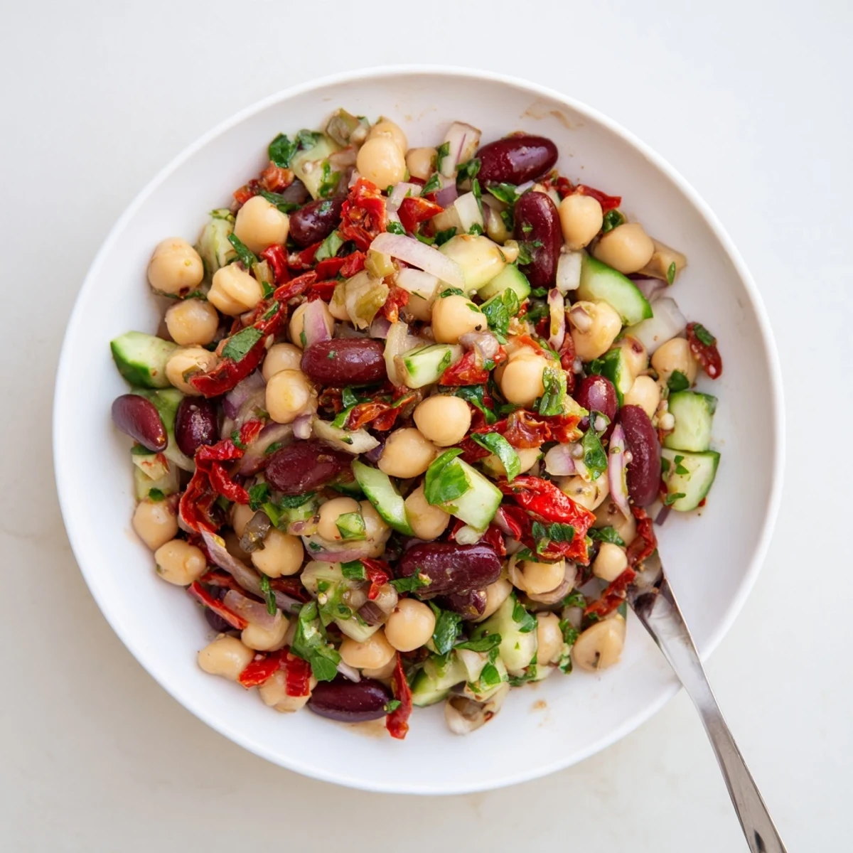 Dense Bean Salad With Sun Dried Tomatoes tossed in bright olive oil and herbs