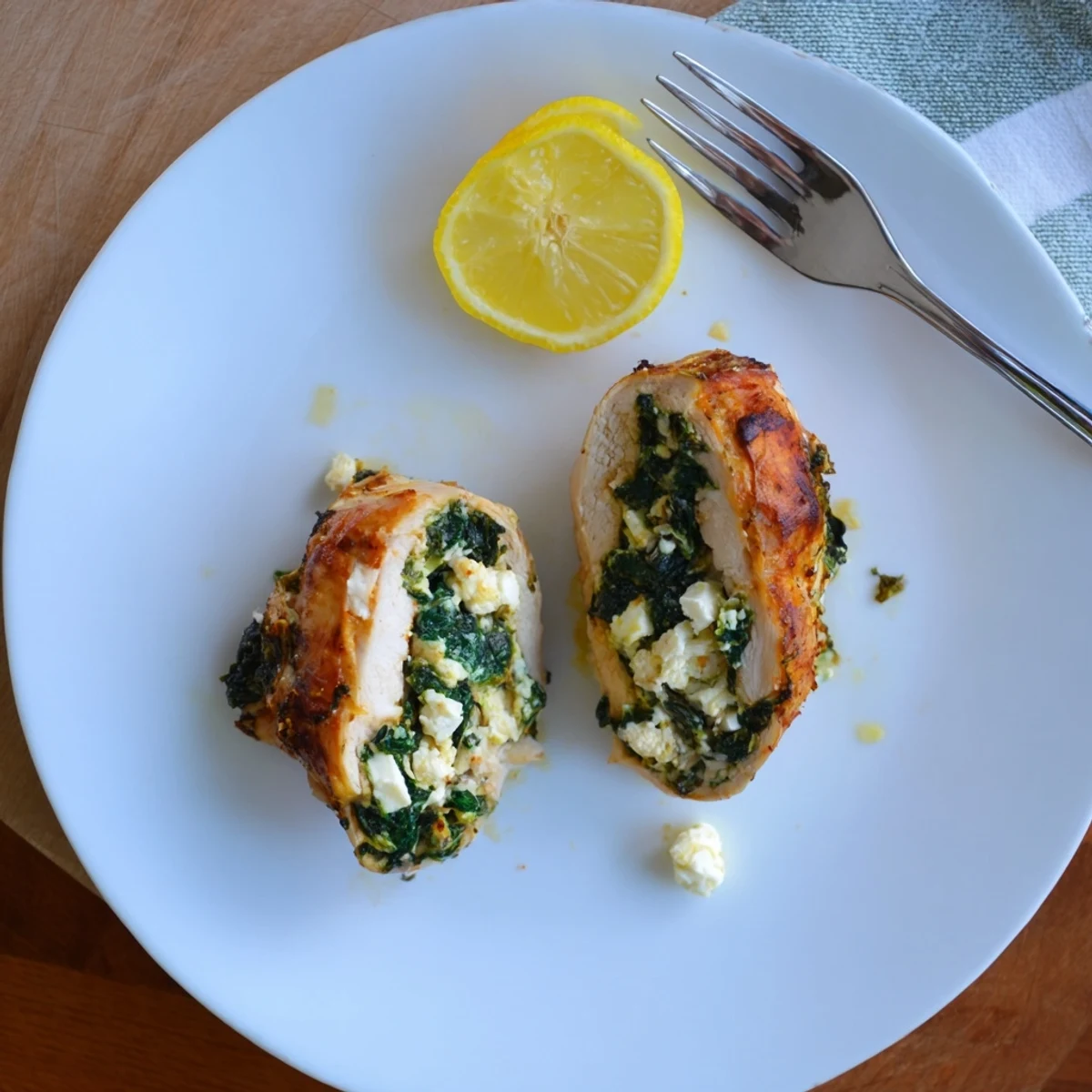 Juicy stuffed chicken breast oozing creamy feta and tender wilted spinach