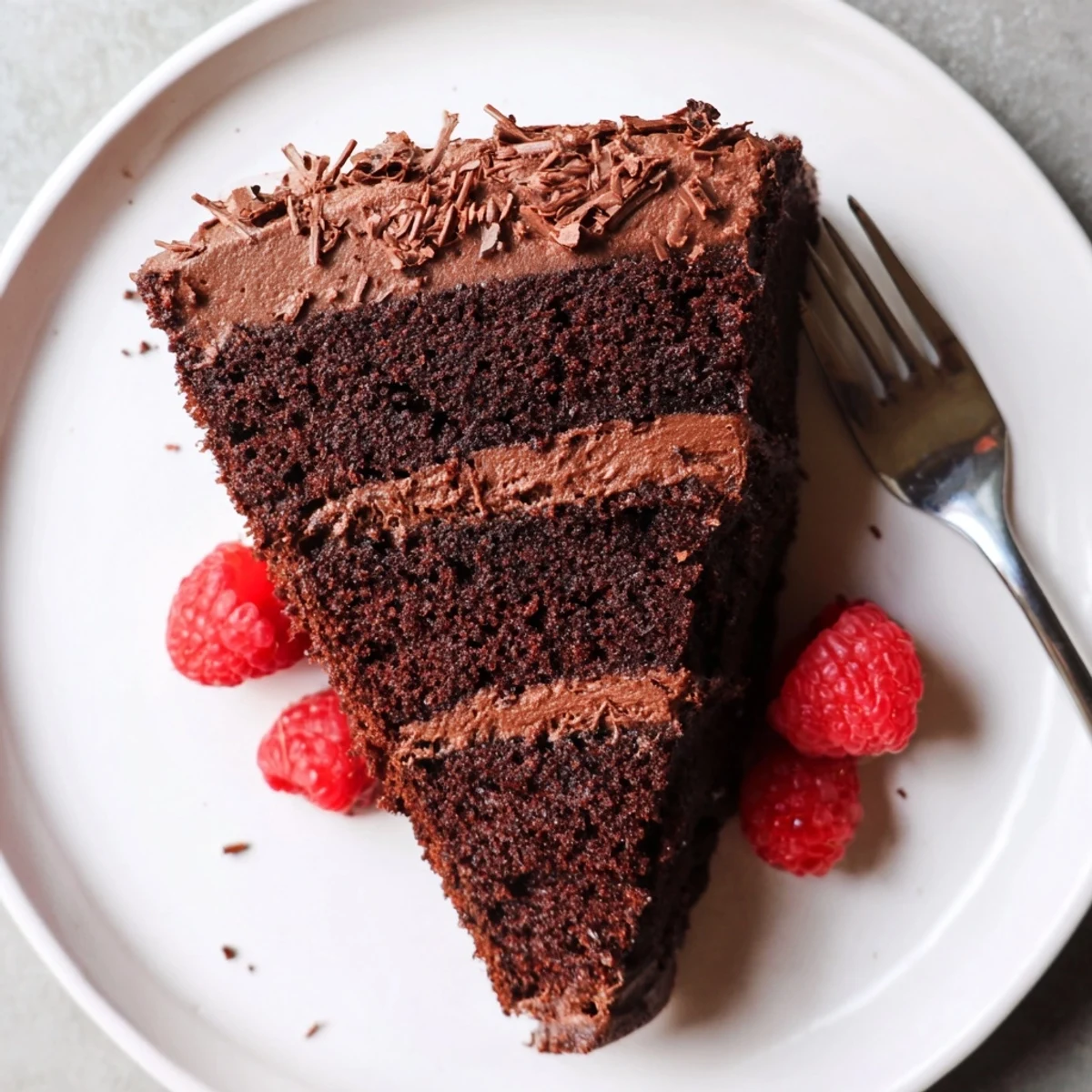 Chocolate Cake Recipe: moist layers frosted glossy, sliced on a cooling rack