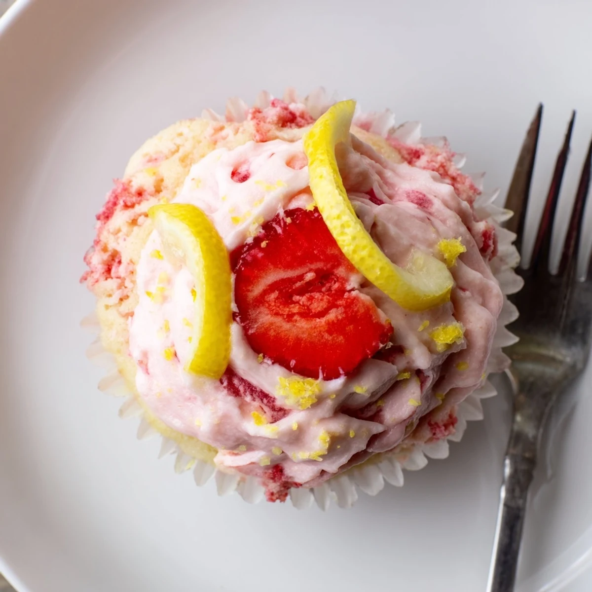 Fresh-baked Strawberry Lemonade Cupcakes cooling on rack, tender crumbs and bright frosting