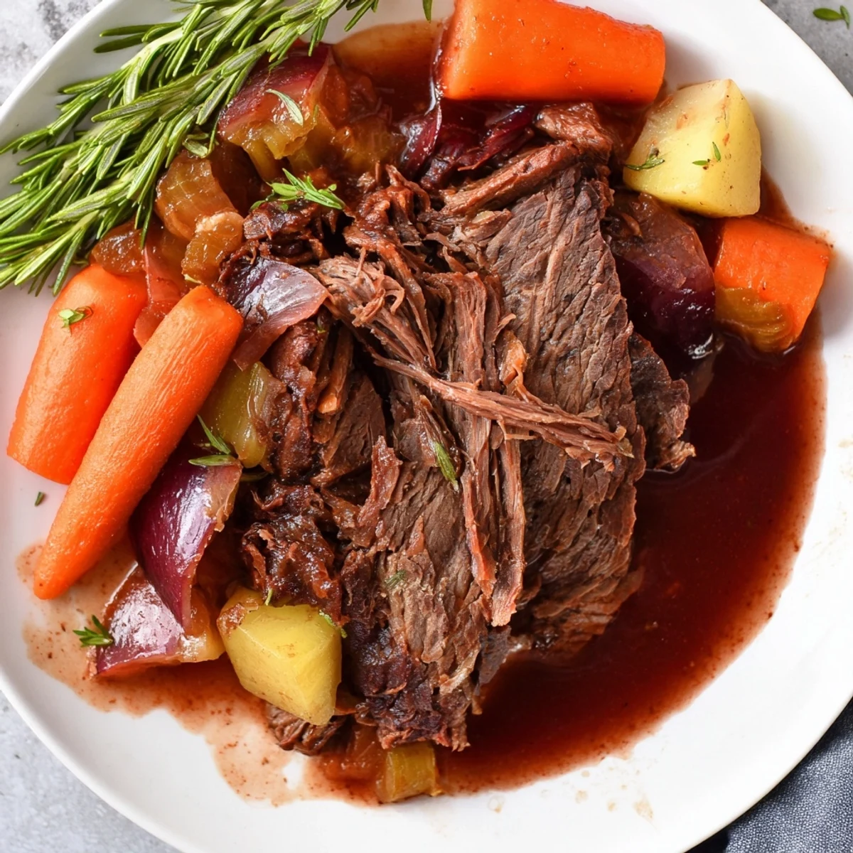 Perfect Pot Roast sliced thick and served alongside fork-tender celery and savory pan juices